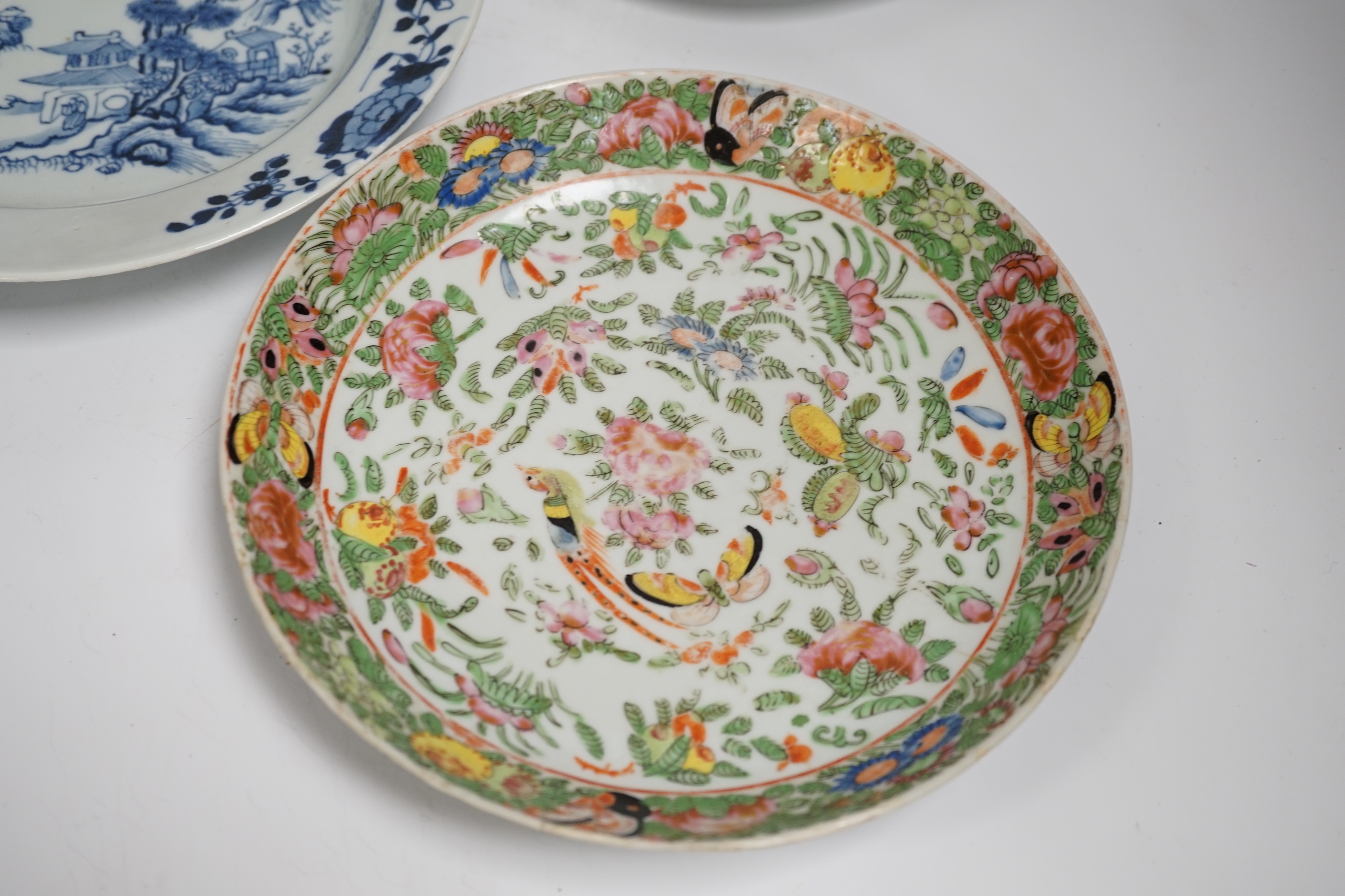 Two 18th century Chinese export plates and a 19th century Canton plate, largest 23cm